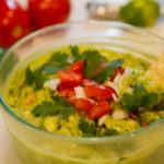 Classic Guacamole with diced tomatoes, onions and cilantro